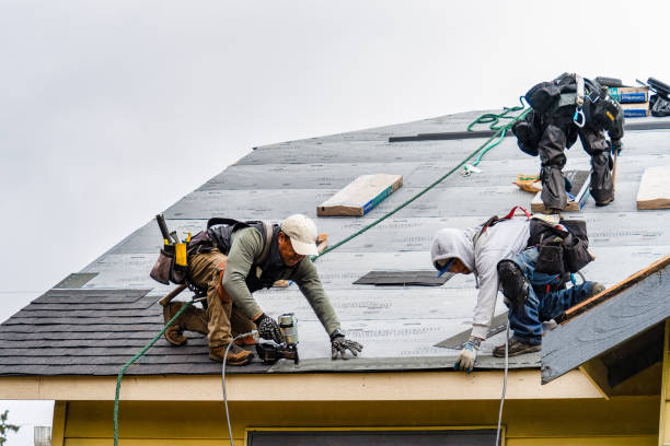 Professional Gutter Installation technician working in Waltham, MA